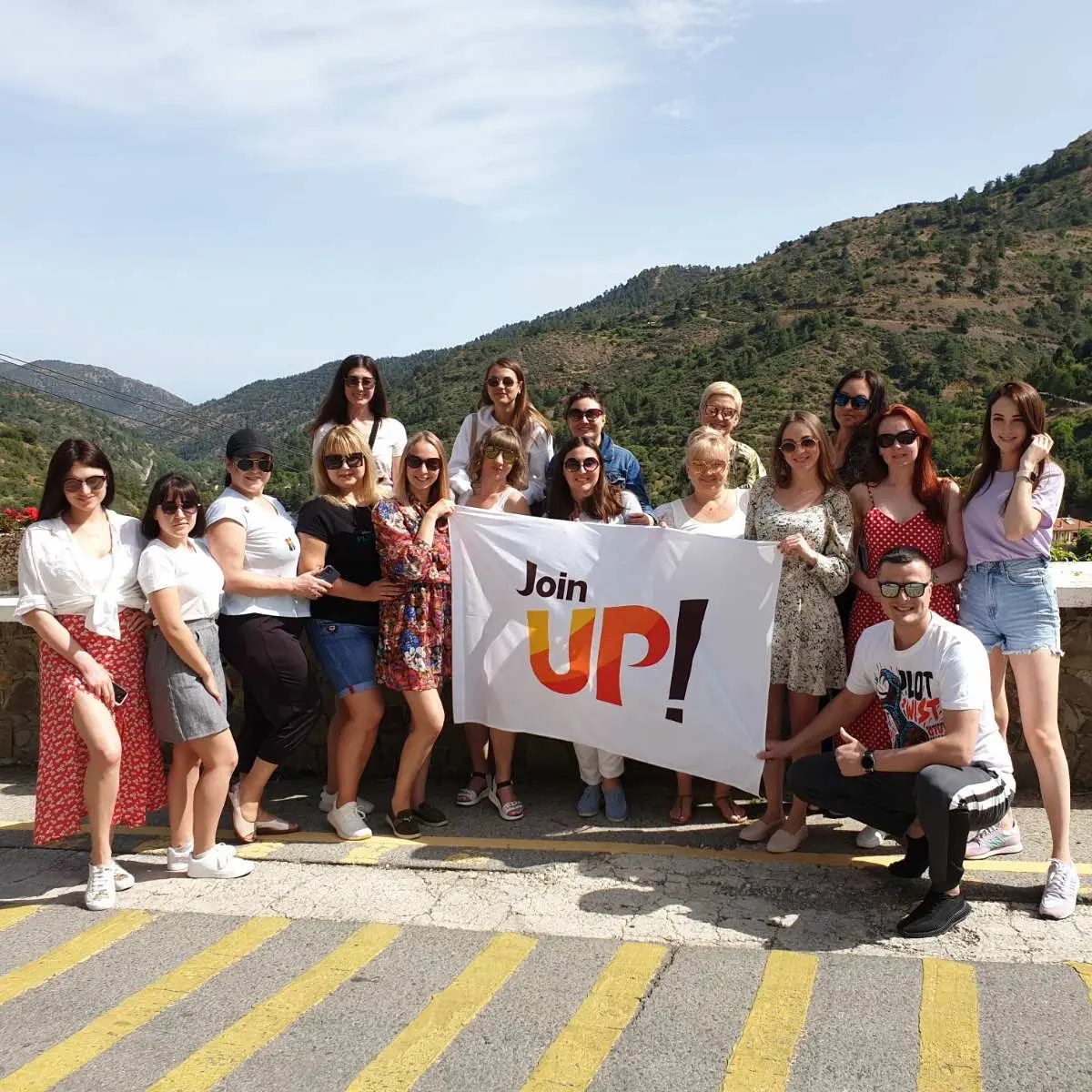 Join UP! team with the brand logo on the background of the mountains