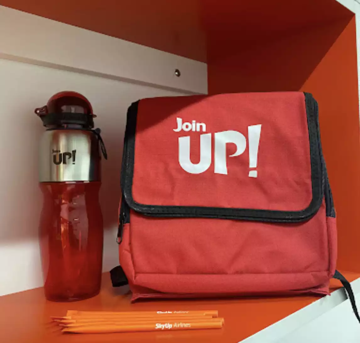 Gifts from Join UP! in the form of a branded flask and backpack